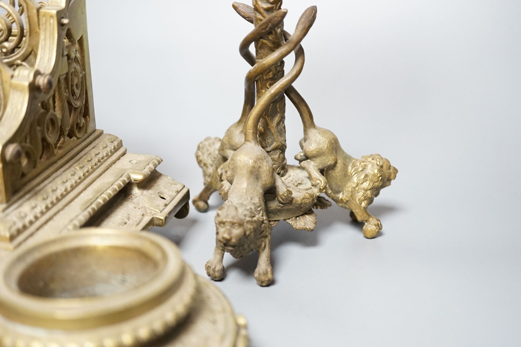 A 19th century bronze desk stand and a similar ‘rams head’ and ‘lion’ candlestick, height 33cm